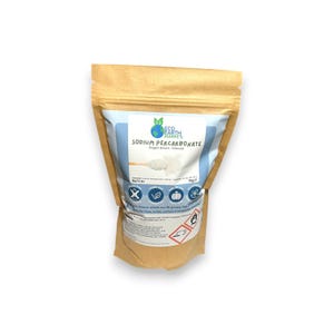 May include: A brown paper bag of sodium percarbonate granules, also known as oxygen bleach. The bag has a blue and white label with the product name and a logo. The bag is sealed and has several icons and hazard symbols.
