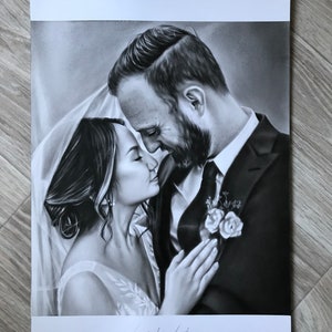 May include: A black and white drawing of a bride and groom embracing. The bride is wearing a white dress and veil, and the groom is wearing a black suit. The drawing is signed "Dylando Thomas".