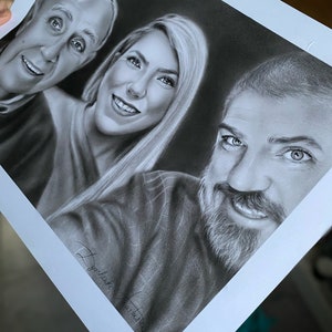 May include: A black and white pencil drawing of three people. The drawing is signed "J.Gonzalez Art Studio".