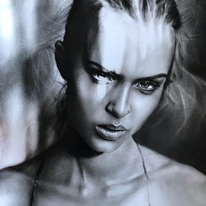 May include: A black and white portrait of a woman with a serious expression. Her hair is styled up, and she is looking directly at the viewer. The artwork is signed in the bottom right corner.