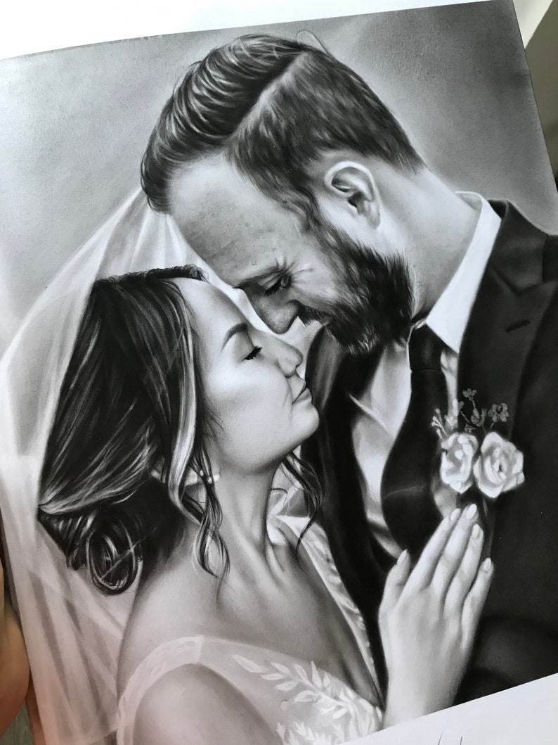 May include: A black and white drawing of a couple in a wedding setting. The bride is wearing a white dress and veil, and the groom is wearing a suit. They are looking at each other with love and affection.