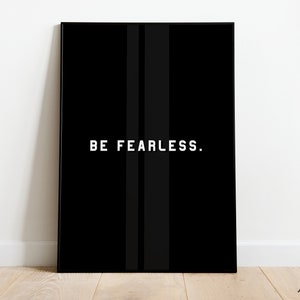 May include: Black and white motivational poster with the text "BE FEARLESS." printed in white on a black background.