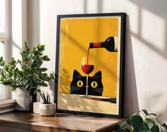May include: A framed vertical art print featuring a black cat with large yellow eyes peering over a table. A wine bottle pours red wine into a glass positioned directly in front of the cat against a solid mustard yellow background.
