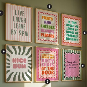 May include: A collection of six rectangular wall art prints in wooden frames, each featuring colourful typography and graphic patterns. The prints display humorous phrases including Live Laugh Leave By 9PM, Meats And Cheeses, and Nice Bum.