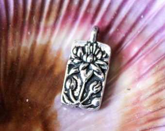 Floating Lotus Tag Charm in Silver Plate from Tierracast