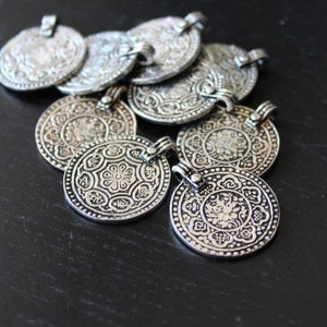 Eight Signs Buddhist Pendant in Antiqued Silver Plate. Tierracast Pewter.