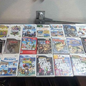 Wii-Konsole + Spiele Kinder Titel neue Super Mario Bros Party Galaxy Kart Sport Sport Urlaubsort Spongebob Lego Karneval Schlümpfe Angeln etc