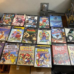 Gamecube console + Games paper mario sunshine kart party Baseball strikers Mario smash melee Pokémon XD donkey Kong sonic metroid etc