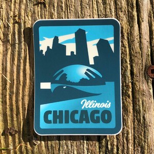 May include: A blue and white sticker with a silhouette of the Chicago skyline and the text "Illinois CHICAGO".