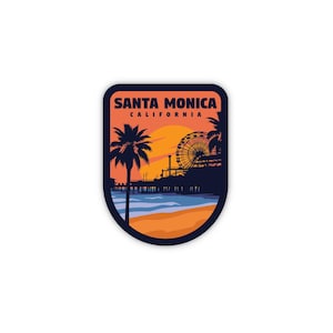 Puede incluir: Una pegatina azul y naranja con el texto "SANTA MONICA CALIFORNIA" y una silueta de una noria, palmeras y un muelle sobre un fondo de puesta de sol.