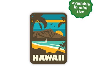 May include: A brown rectangular sticker with a colorful illustration of a beach scene with palm trees, a mountain, a sailboat, and the word "HAWAII" in white text.