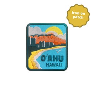 May include: A rectangular iron-on patch depicting a Hawaiian landscape. The patch shows a beach, mountains, and a sunset. The text "O'AHU HAWAII" is in blue. A separate yellow patch reads "iron on patch".