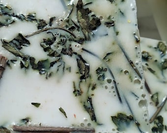 The Mintal Block All Natural Goat's Milk Bar Soap lined with dried mint leaves