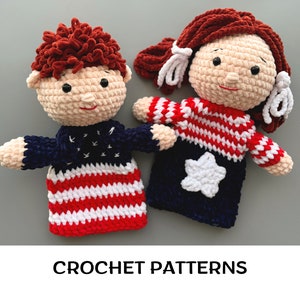 May include: Two crocheted dolls dressed in red, white, and blue, reminiscent of the American flag. The dolls are holding hands and have a friendly expression on their faces. Crochet patterns.