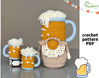 May include: Crochet pattern PDF for a beer stein gnome. The gnome is wearing a white crocheted hat and a white crocheted collar. The beer stein is yellow with a blue rim and a white foam top. There are two smaller beer stein gnomes in the background.