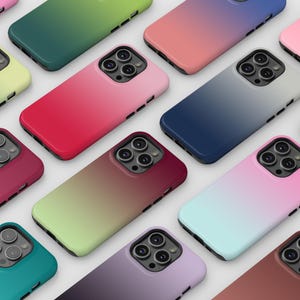 May include: A collection of smartphone cases featuring various gradient color schemes. Each case has a rectangular shape with rounded corners, a camera cutout with three circular lenses, and side buttons. The colors include pink, green, blue, and purple.