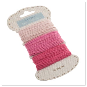 May include: Three spools of pink, light pink, and white twine, each 5 metres long, packaged together on a card labelled "Groves Trim Collection".