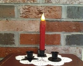 Taper Candle, Timer Candle, Red Candle, Batteries and Holder included