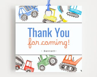 May include: A square card featuring watercolour illustrations of construction vehicles, such as a dumper truck and excavator. The card says "Thank You for coming!" in blue and orange, with the name "- Bennett -" below.