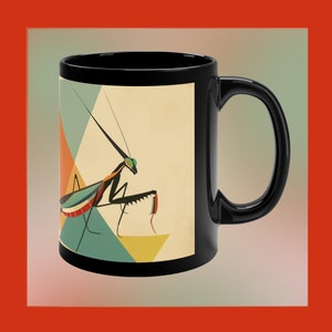 May include: Black coffee mug with a geometric design featuring a green and black praying mantis on a white, yellow, and blue background.