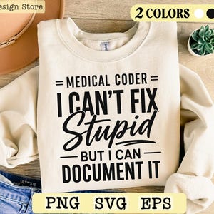May include: A cream-coloured crewneck sweatshirt featuring black text that reads: MEDICAL CODER I CAN'T FIX Stupid BUT I CAN DOCUMENT IT. The design includes horizontal lines above and below the text, presented on a long-sleeved garment.