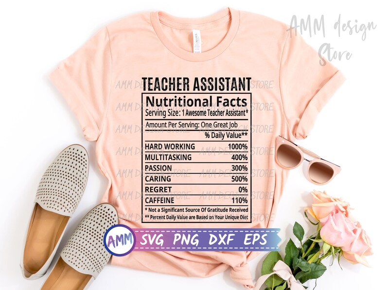 May include: A pink t-shirt with the text "Teacher Assistant Nutritional Facts" and a list of qualities with percentages. The text includes "Hard Working 1000%", "Multitasking 400%", "Passion 300%", "Caring 500%", "Regret 0%", and "Caffeine 110%". The text also includes "*Not a Significant Source of Gratitude Received" and "**Percent Daily Value are Based on Your Unique Diet".