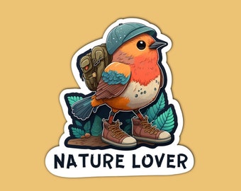 May include: A cartoon robin wearing a blue hat and carrying a brown backpack, with the text "NATURE LOVER" below it.
