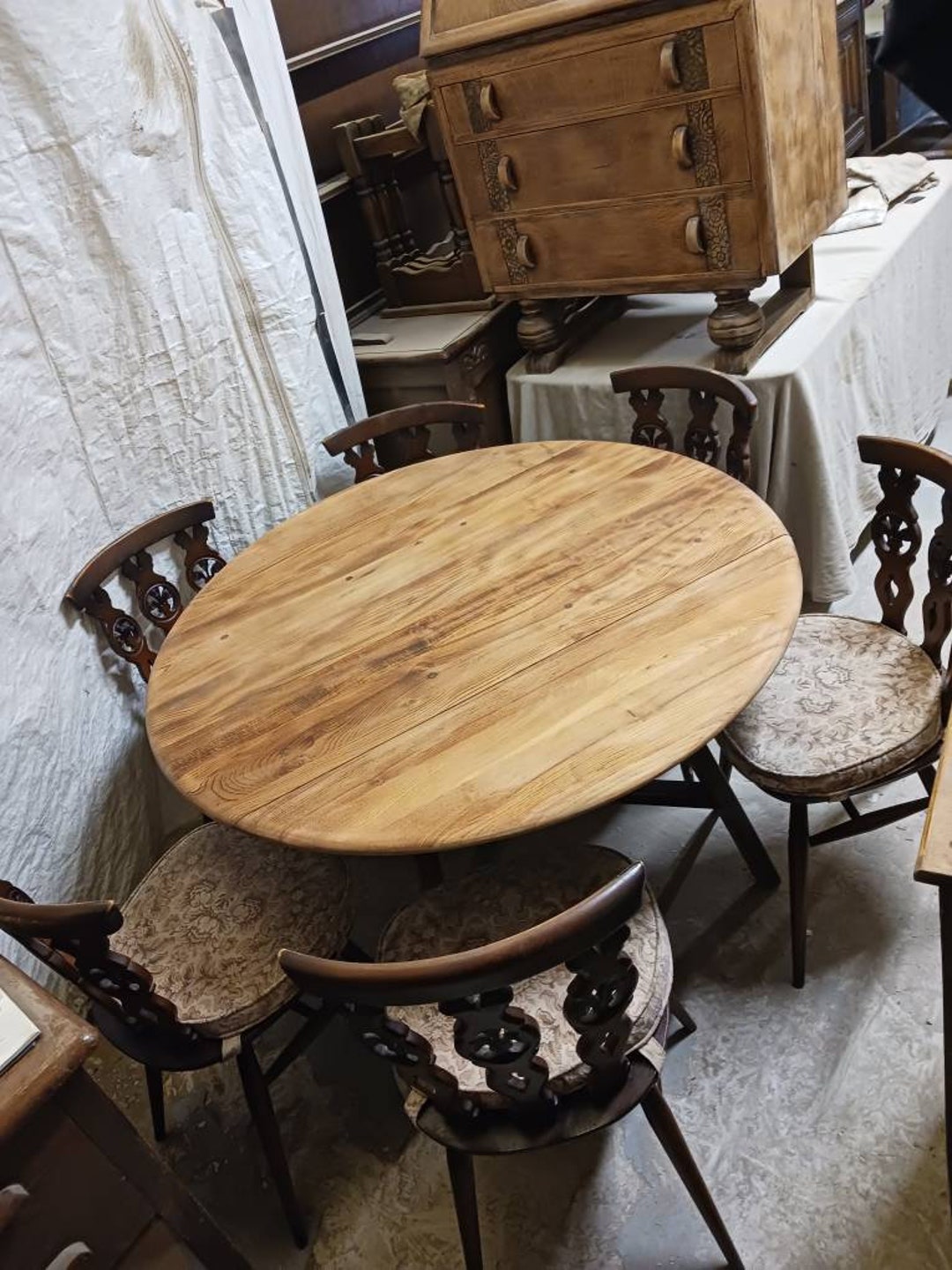 Part Stripped Ercol Drop Leaf Table Together With Six Ercol Plume