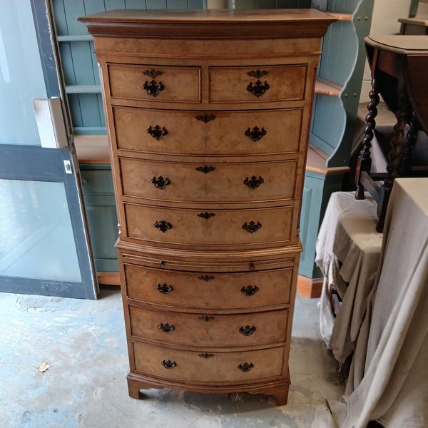 Reproduction Walnut Bow Front Chest on Chest.