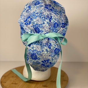 Shades of blue women’s floral scrub cap, blue floral ponytail scrub hat