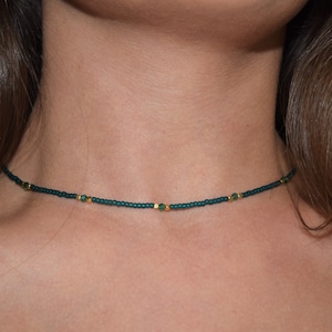 Emerald green pearl necklace made of Toho pearls and cut glass beads with gold choker