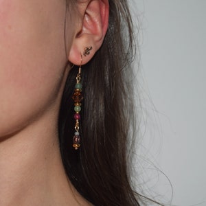 Jade bead hanging earrings with faceted cut glass beads in turquoise, brown, purple and gold - wire wrapping