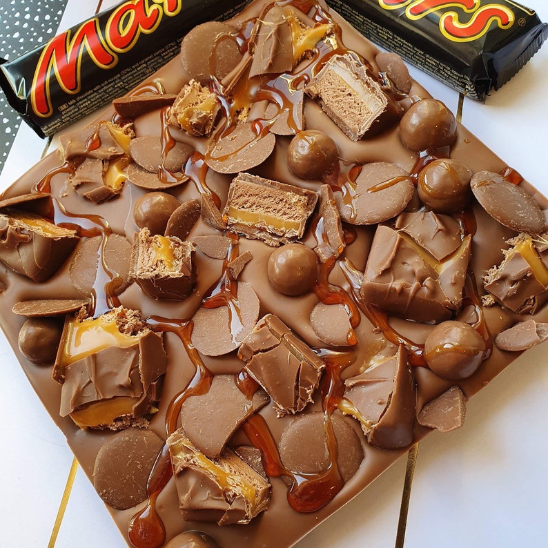 mars bar covered belgium milk chocolate. kinder bueno. kinder mars bars. maltesers. chocolate buttons. caramel image 1