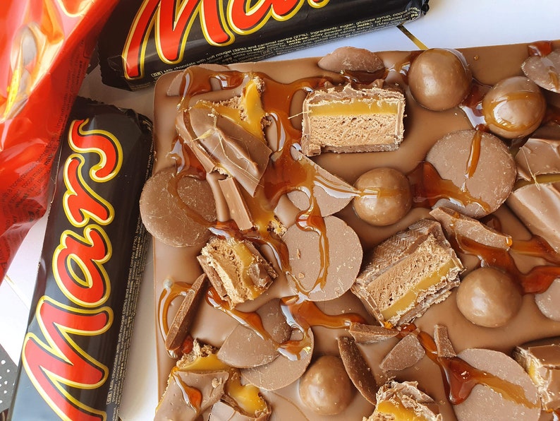 mars bar covered belgium milk chocolate. kinder bueno. kinder mars bars. maltesers. chocolate buttons. caramel image 3