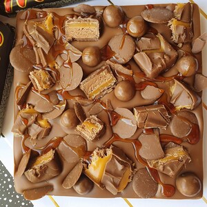 mars bar covered belgium milk chocolate. kinder bueno. kinder mars bars. maltesers. chocolate buttons. caramel image 4