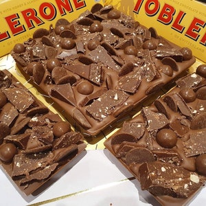 toblerone milk chocolate slab. Maltesers. chocolate buttons. toblerone.