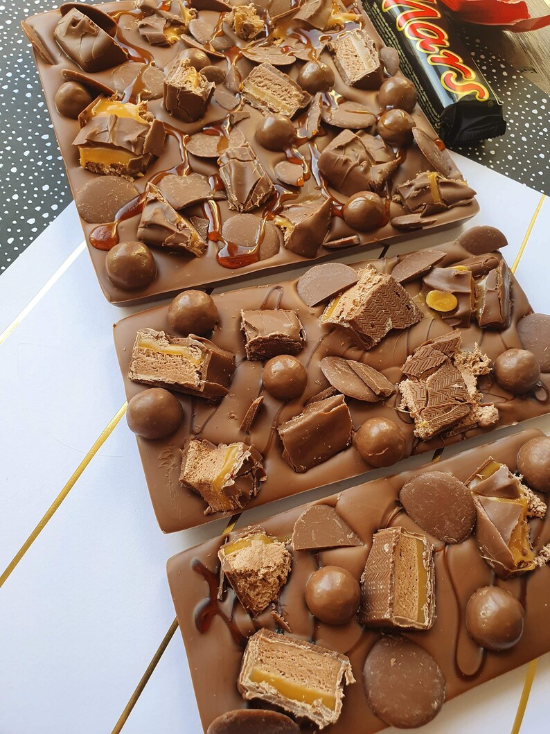 mars bar covered belgium milk chocolate. kinder bueno. kinder mars bars. maltesers. chocolate buttons. caramel image 2