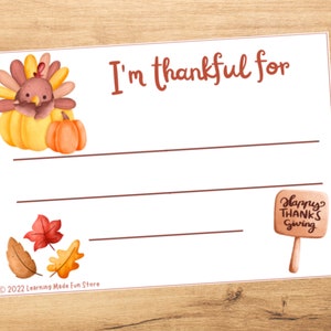 May include: A printable Thanksgiving activity card featuring a cartoon turkey and pumpkin. The card has the text "I'm thankful for" and lines for writing. The card also includes a small sign that says "Happy Thanks Giving".