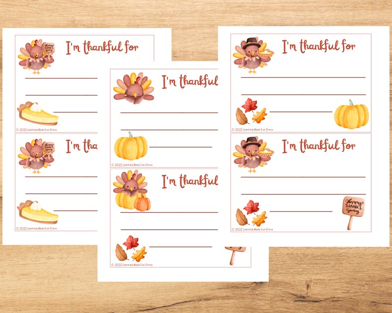 May include: Printable Thanksgiving activity cards featuring illustrations of turkeys, pumpkins, and pie. Each card has a line for writing "I'm thankful for..."