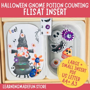 May include: A Halloween-themed gnome potion counting activity for a FLISAT insert. The activity includes a gnome with a cauldron, a ghost, eyeballs, flowers, and pumpkins. The insert also includes a separate tray with a bat, ghost, flower, pumpkin, and eyeballs. The activity is labeled "Boo!" and includes the numbers 4, 3, and 8. The activity is labeled "LARGE + SMALL INSERT PDF US LETTER A4+ A3".