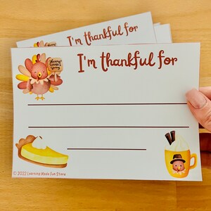 May include: A printable Thanksgiving activity sheet with a turkey illustration and the text "I'm thankful for". The sheet includes lines for writing and a pie and a cup of hot chocolate with a turkey on top.