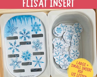 May include: A white plastic tray with a blue and white snowflake pattern insert. The tray contains a pile of white circles with blue snowflake patterns. The text "LARGE + SMALL INSERT PDF US LETTER A4+ A3" is printed on a white label.