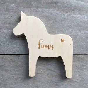 engraved wooden horse