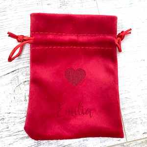 laser-engraved velvet pouch with name, gift packaging, and heart