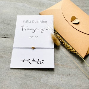 Bracelet et carte de questions pour demoiselle d'honneur dans une enveloppe avec fermoir en forme de cœur