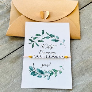 Bracelet et carte de questions pour demoiselle d'honneur dans une enveloppe avec fermoir en forme de cœur