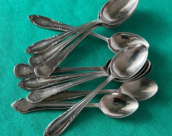 Mismatch of 10 vintage Silver plated tea spoons. 8 of them with engraved initials. Marked with NS Alp. In used vintage condition.