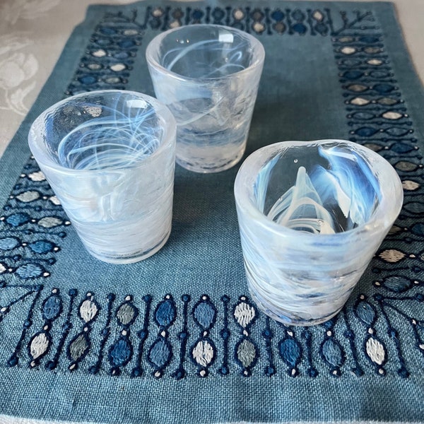 3 Shot Glasses. Mine Designed by Ulrica Hydman Vallien Kosta Boda Sweden. Made in the 1980's. White Colour Swirls in Clear Glass.