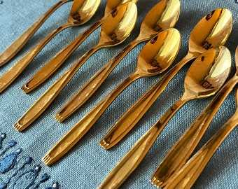 Set of 10 Vintage Gold Washed Tea/Coffee spoons. In used vintage condition. "Fold in" sides and striped pattern on top of the handles.