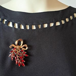 TRIFARI Brass Brooch with Glass Cabochons. Red and Gold. Bow. Signed. Needle with Roll Over Clasp.